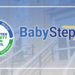Graphic featuring the Worcester Community Action Council logo alongside the BabySteps program logo, set against a faded background image of the WCAC building's front steps and entrance. A yellow outline of Massachusetts appears on the right side, and a white border frames the graphic.