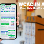 A hand holds up a smartphone displaying the "WCAC in Action" monthly eNewsletter, with sections on Fuel Assistance, Early Education & Care, and Resiliency visible on screen. To the right, bold white text reads "WCAC in Action: Read This Month's eNewsletter!" against a blurred background of a community office space with a wooden podium.
